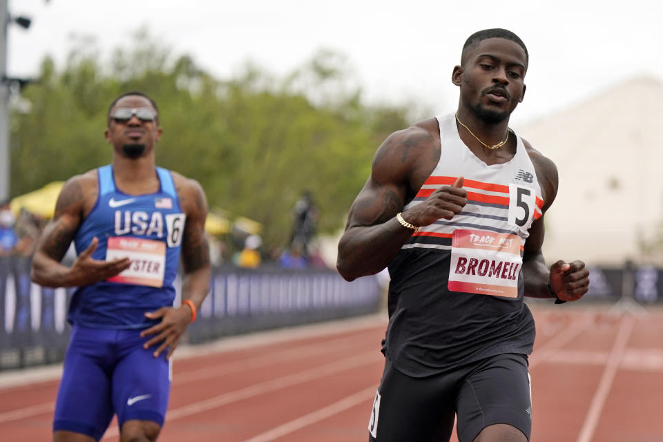 FILE - In this Saturday, May 15, 2021, file photo, Trayvon Bromell, right, wins the 100-meter dash during the Sound Running Track Meet in Irvine, Texas. Bromell is one of the favorites in a 100-meter field that includes Noah Lyles and veteran Justin Gatlin at the U.S. Olympic track and field trials. (AP Photo/Marcio Jose Sanchez, File)