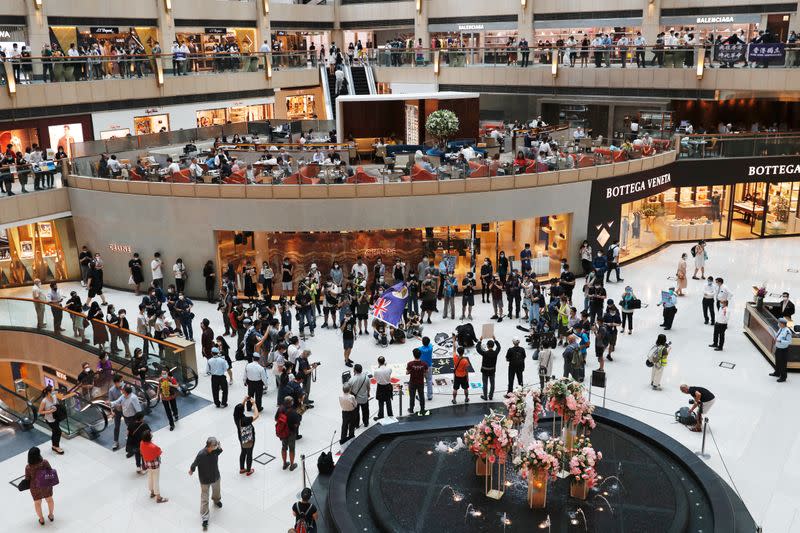 Pro-democracy demonstrators stage a rally at a shopping mall in Hong Kong