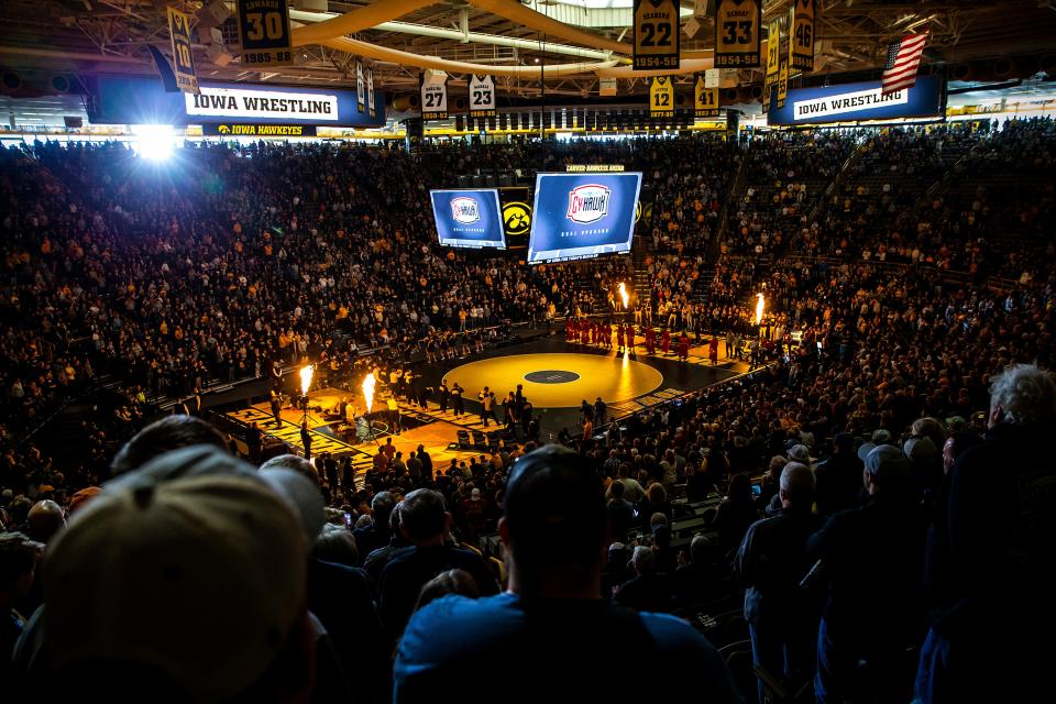 A general view as thousands of fans watch wrestlers being introduced during a Cy-Hawk Series NCAA men's wrestling dual between Iowa and Iowa State.