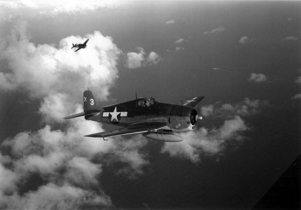 An F6F Hellcat from the aircraft carrier USS San Jacinto flies over the Pacific in 1944-45. Lt. Charles W. Wilson of Tecumseh flew Hellcats and would have been aboard the San Jacinto when this picture was taken.