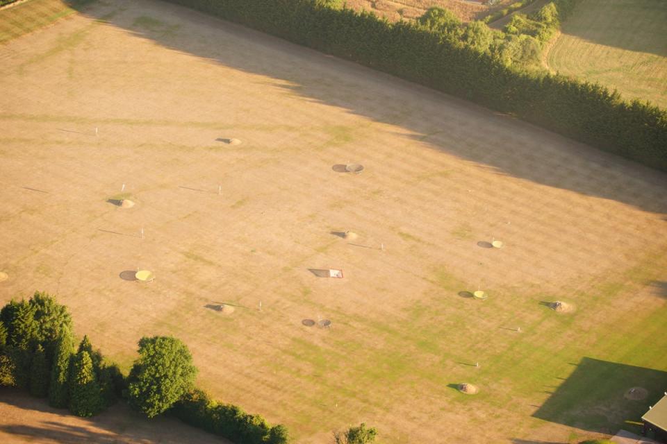 A dried out field near Bristol, where the prolonged dry conditions, have left the parched land turning from green to brown (PA)