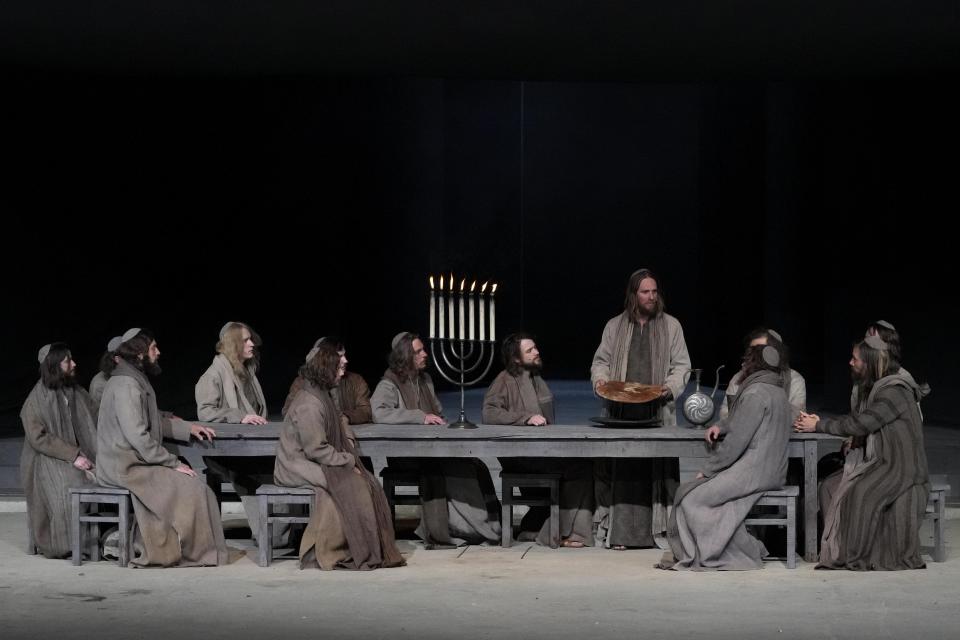 Frederik Mayet as Jesus performs during the rehearsal of the 42nd Passion Play in Oberammergau, Germany, Wednesday, May 4, 2022. After a two-year delay due to the coronavirus, Germany's famous Oberammergau Passion Play is opening soon. The play dates back to 1634, when Catholic residents of a small Bavarian village vowed to perform a play of the last days of Jesus Christ every 10 years, if only God would spare them of any further Black Death victims. The town did suffer some COVID-19 deaths, but the show goes on. Almost half of the village's residents— more than 1,800 people including 400 children — will participate. (AP Photo/Matthias Schrader)