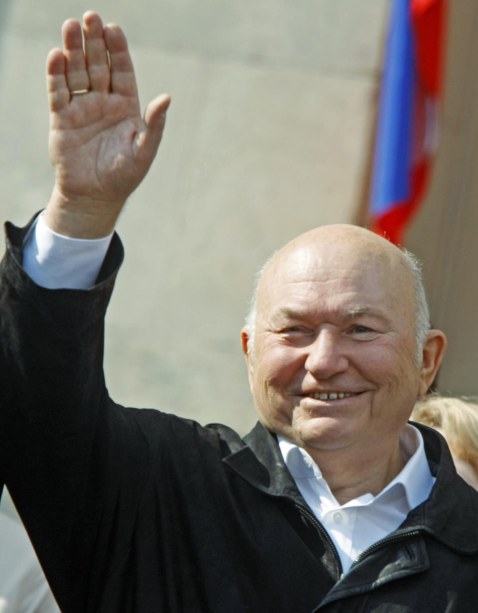 FILE - In this Saturday May 1, 2010 file photo, Moscow Mayor Yuri Luzhkov waves as United Russia party and government-linked trade unions take to the streets to mark May Day in Moscow. The former mayor of Moscow and one of the founders of Russia's ruling United Russia party, Yuri Luzhkov, has died at the age of 83. Russia's Ren TV channel reported Tuesday Dec. 10, 2019, that Luzhkov died in Munich, where he was undergoing heart surgery. (AP Photo/Mikhail Metzel)