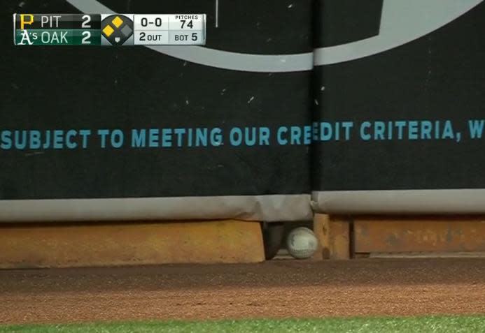 Josh Reddick's drive finds a hole in the wall in Oakland. (MLB)