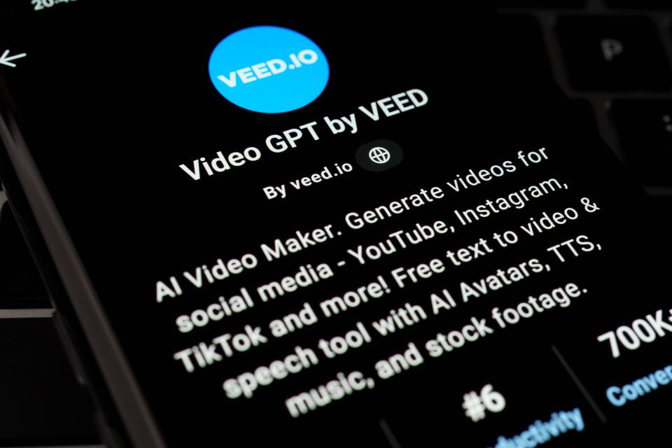 VIDEO GPT by VEED custom GPT seen in GPT Store on the screen of smartphone placed on laptop keyboad. Stafford, United Kingdom, April 8, 2024