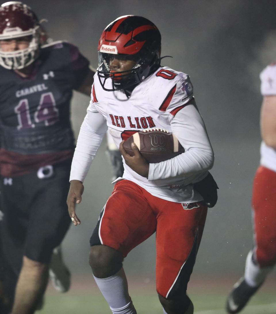 Red Lion Christian freshman Mekhi Corbin runs the ball in the Caravel’s 31-6 win over the Lions, Friday, Nov. 10, 2023 at Bob Peoples Stadium.