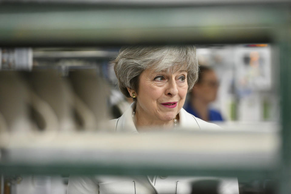 Britain's Prime Minister Theresa May looks on, during a visit to the Portmeirion pottery factory in Stoke-on-Trent, England, Monday, Jan. 14, 2019. May is due to make a statement in the House of Commons on Monday afternoon, a day before lawmakers are due to vote on her EU divorce deal. May argues that defeating the deal could open the way for EU-backing legislators to block Brexit. (Ben Birchall/PA via AP)