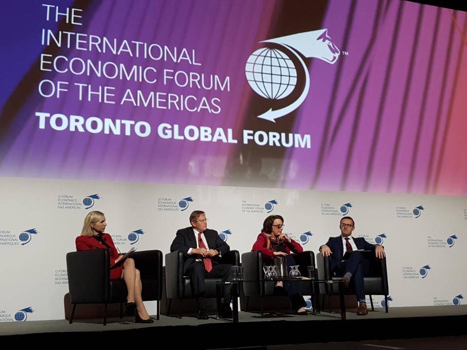 Guy Cormier (right) was part of a panel at the International Economic Forum of the Americas in Toronto on Dec. 10.