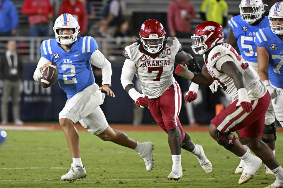 Mississippi quarterback Jaxson Dart (2) scrambles with the ball during the second half of an NCAA college football game against Arkansas in Oxford, Miss., Saturday, Oct. 7, 2023. (AP Photo/Thomas Graning)