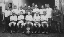 <p>A football team from ‘No.8 Troop – E Squadron’, made up of an unidentified British regiment, sit with their trophy. One lieutenant on the right has a Military Cross ribbon. (Courtesy Kerry Stokes Collection, The Louis and Antoinette Thuillier Collection) </p>