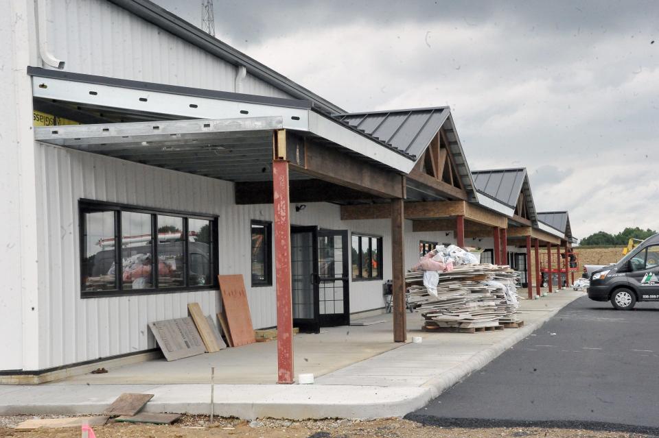 The east side of the building will house several businesses, a cafe and several offices.