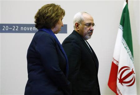 European Union foreign policy chief Catherine Ashton (L) arrives with Iranian Foreign Minister Mohammad Javad Zarif during a photo opportunity before the start of three days of closed-door nuclear talks at the United Nations European headquarters in Geneva November 20, 2013. REUTERS/Denis Balibouse