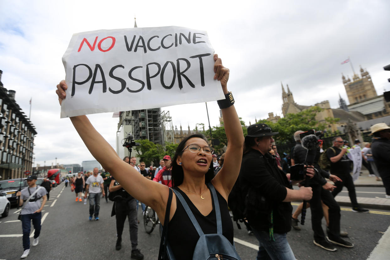 Anti-vaccine protesters march against Covid vaccine passport plans through central London