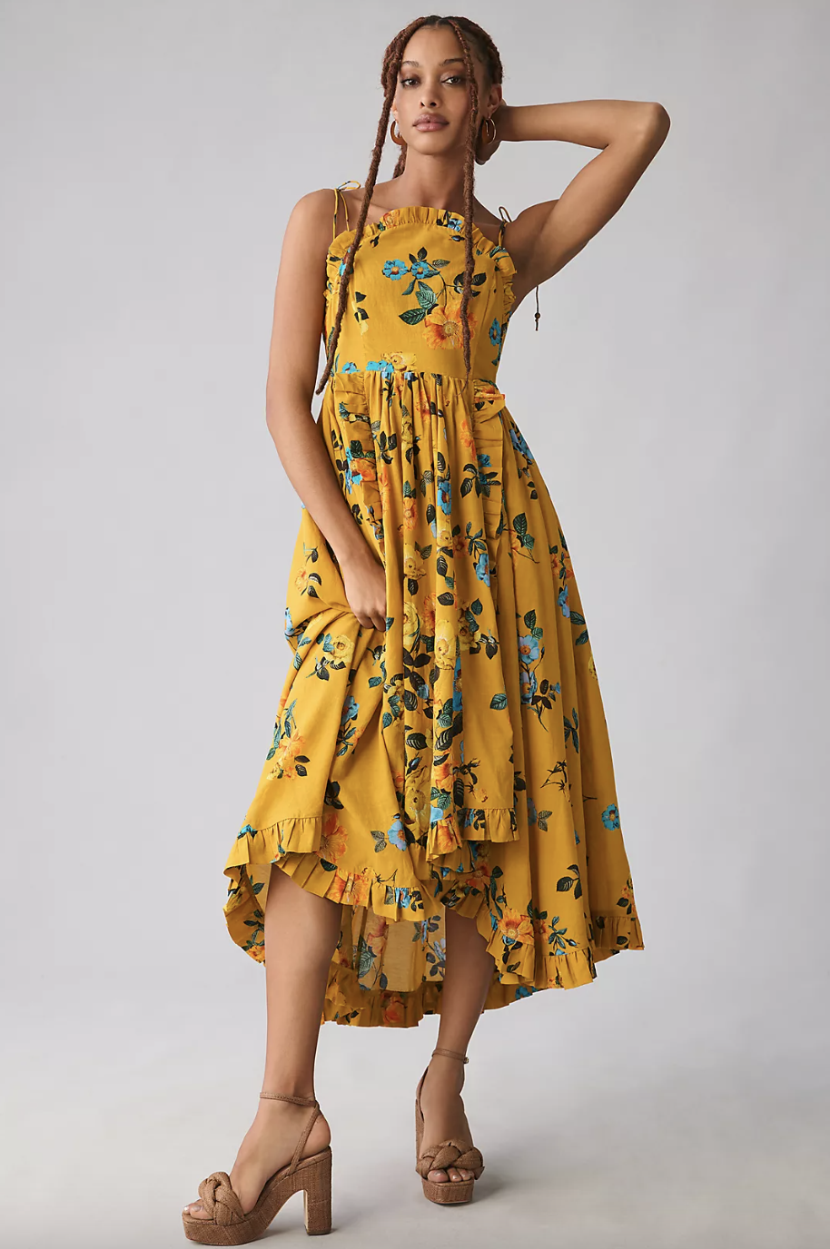 model wearing yellow floral Maeve High-Low Pleated-Trim Dress (photo via Anthropologie)