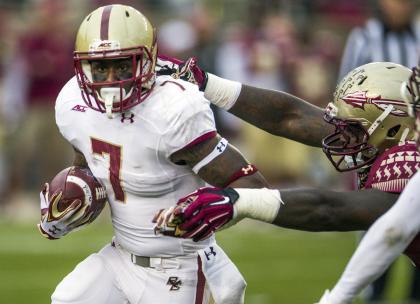 Boston College running back Marcus Outlow, left, breaks a tackle by Florida State Mario Edwards Sr. during the first half of an NCAA college football game in Tallahassee, Fla., Saturday, Nov. 22, 2014. (AP Photo/Mark Wallheiser)