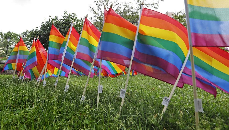 Quincy Pride flags fly at the United First Parish Church in Quincy Square on Thursday, June 11, 2020.