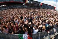 <p>Thousands packed into Old Trafford cricket ground for the one-off benefit concert . (Getty) </p>