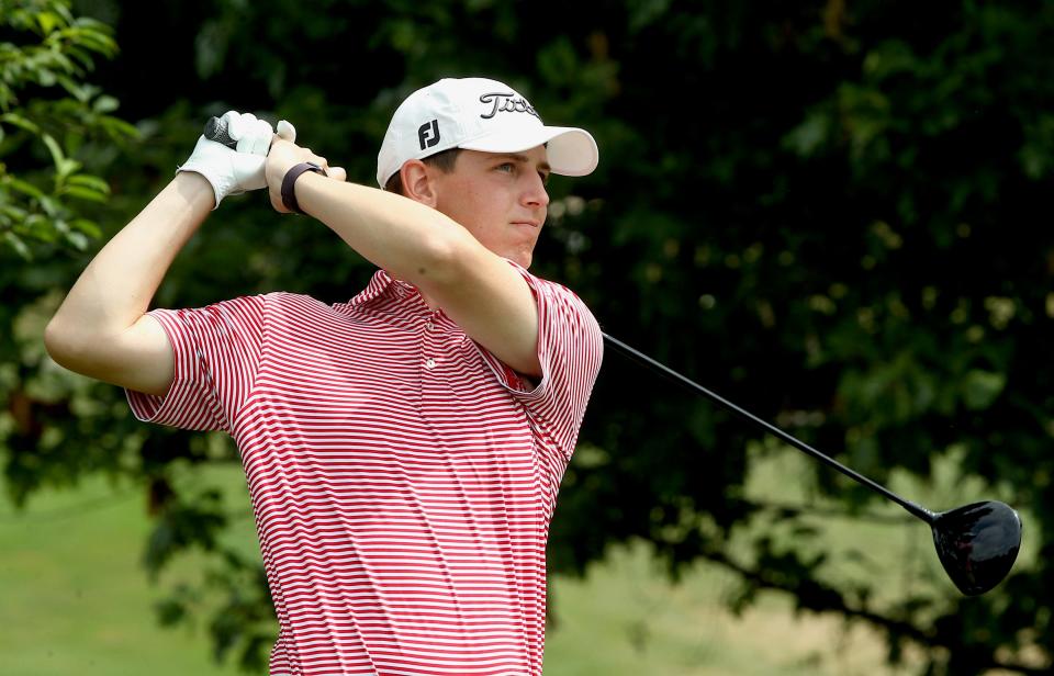 Nick Burris hits from the second tee at Cascades Golf Course during the City Qualifying Tournament on Sunday, June 26.