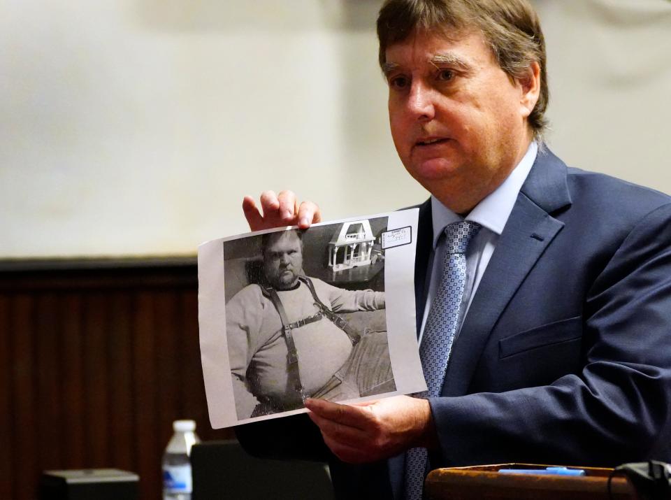 During his closing argument in the trial of George Wagner IV, defense attorney John P. Parker shows jurors a photo of Wagner IV's father, George "Billy" Wagner III. Parker was trying to establish that both Wagner men were too large to have dragged two victims through a narrow passage in one of the 2016 crime scenes.