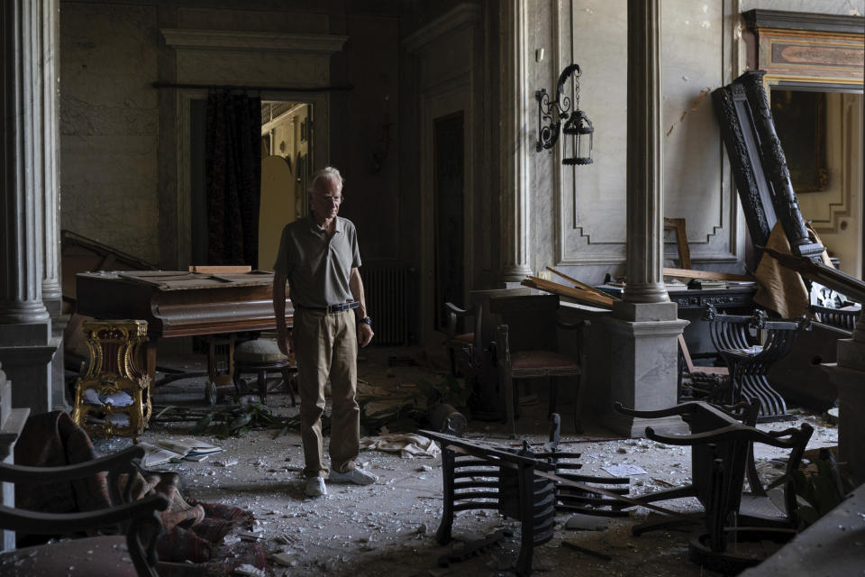 Roderick Sursock stands in a heavily damaged room of the Sursock Palace, affected by the explosion in the seaport of Beirut, Lebanon, Saturday, Aug. 8, 2020. "In a split second, everything was destroyed again," said Sursock, owner of the charming Sursock Palace, one of the most prominent and well-known buildings in the Lebanese capital. (AP Photo/Felipe Dana)