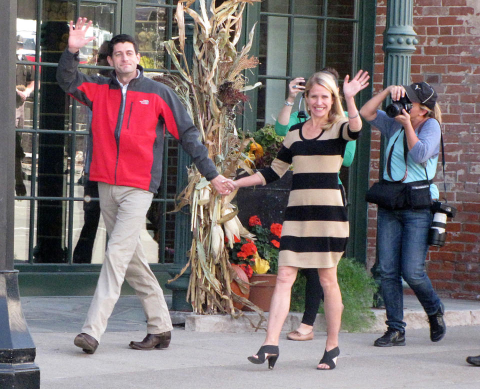 Republican vice-presidential candidate Paul Ryan and his wife Janna, walk towards Elly’s Tea and Coffee House Tuesday, Oct. 2, 2012, in Muscatine, Iowa. Ryan is on his “Victory in Iowa” bus tour. (AP Photo/Muscatine Journal, Joe Jarosz)