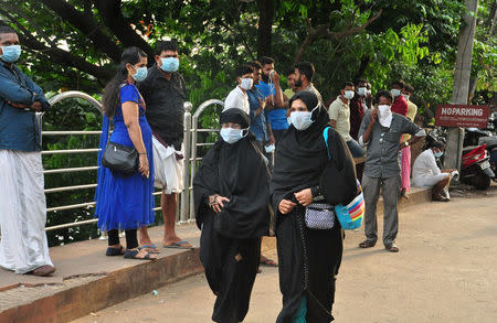 People wearing masks are seen at a hospital in Kozhikode in the southern state of Kerala, India May 21, 2018. REUTERS/Stringer