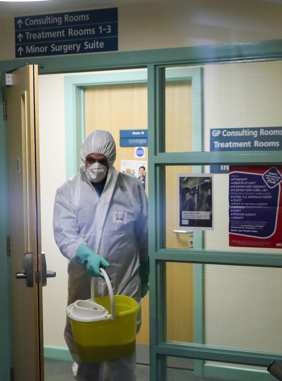 DOOR NAME PIXELATED BY PA PICTURE DESK A man in protective clothing cleaning the County Oak Medical Centre GP practice in Brighton which has been temporarily closed "because of an urgent operational health and safety reason", following reports a member of staff there was one of those infected with coronavirus. PA Photo. Picture date: Monday February 10, 2020. Four more patients in England have tested positive for coronavirus, bringing the total number of cases in the UK to eight. See PA story HEALTH Coronavirus. Photo credit should read: Steve Parsons/PA Wire ... Coronavirus ... 10-02-2020 ... Brighton ... UK ... Photo credit should read: Steve Parsons/PA Wire. Unique Reference No. 50251688 ... (Photo by Steve Parsons/PA Images via Getty Images)