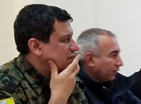 Mazloum Kobani, the commander-in-chief of the Kurdish-led Syrian Democratic Forces (SDF) listens during talks with senior U.S. generals at an undisclosed location in northeast Syria, February 18, 2019. REUTERS/Stringer