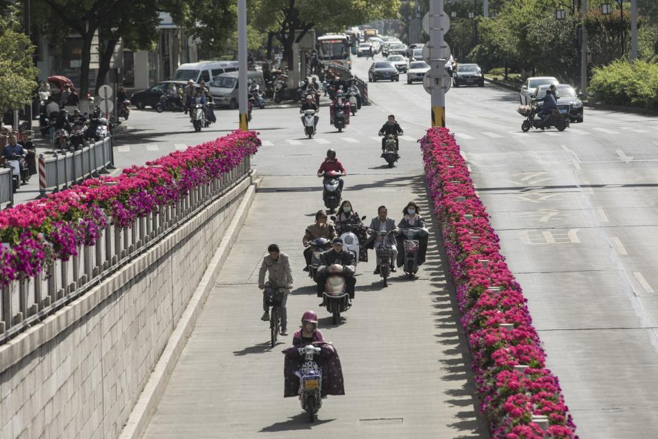 (Bloomberg) -- The city of Suzhou, known as “the Venice of the East” for its web of intricate waterways, captured the imagination of Marco Polo when he journeyed through China more than seven centuries ago.Today it’s drawing attention for another grand project: a sprawling network of databases designed to track the behavior of China’s population. Sitting next to Shanghai with an economy larger than Finland’s, Suzhou was one of a dozen places chosen in 2018 by President Xi Jinping’s government to run a social-credit trial, which can reward or punish citizens for their behavior.The system, dubbed “Osmanthus” after the fragrant flower the city uses as an emblem, collects data on nearly two dozen metrics, including marital status, education level and social-security payments. Authorities have given it national awards even as Western politicians like U.S. Vice President Mike Pence lambaste social credit as ushering in an Orwellian dystopia that could serve as a model for authoritarian regimes around the globe. But dozens of interviews with the people most affected by the system paint a nuanced picture of the technology in its early stages. Few of the entrepreneurs, volunteers, public servants and other Suzhou residents surveyed said they had even heard of Osmanthus, which is supposed to help shape laws, regulations and standards across China by 2020.China’s Radical Plan to Judge Each Citizen’s Behavior: QuickTakeSuzhou’s experience raises questions about the dozens of similar scoring projects that local cities are now rolling out. If residents are unaware of a system designed to change their behavior for the better, then what’s the point of having it? And if it’s struggling to take off in a city lauded by authorities, what are the chances it can be implemented effectively across the nation anytime soon?“China has an interest in overstating its capacity to collect and analyze data, like they overstate their capacity to monitor with surveillance cameras and facial recognition,” said Jeremy Daum, a senior fellow at the Paul Tsai China Center at Yale Law School. “They want people to believe that misconduct will get caught.”A three-story brown and white building near the city center is the public face of Suzhou’s social-credit system. Here individuals can ask questions about their scores.On a recent Monday afternoon, the building was largely empty. Two staff shuffled papers and typed at computers, while six seats reserved for visitors were vacant. One woman who entered was lost and asked for directions. The lone self-service machine, emblazoned with logos for Osmanthus and state-owned telecoms company China Unicom, was unplugged.A female official in jeans and a t-shirt, who only gave her family name Xi, said about 10 people come in each day. Most are small-business owners who want to verify that they’ve been removed from a financial credit blacklist after paying off a debt. She said she’s hardly ever seen anyone come in to check their social-credit score.Proponents of the system says it hews closely to the financial scores pioneered by William Fair and Earl Isaac in the U.S. in the mid-1950s. Today, FICO scores form the basis of the vast majority of loans made to individuals in the U.S. — with occasional debates over how they’re formulated and whether consumers have enough access to them.“People could end up living in fear, worrying that they are being watched all the time.”But China’s social-credit scores arguably go a step further by using the country’s vast surveillance network — public CCTV cameras, payment systems and more — to monitor citizens. While good behavior — such as volunteering, paying bills on time or avoiding fines for littering — is supposed to be rewarded with financial perks, bad behavior can abruptly leave residents without access to financing and public services.Osmanthus collects data on individuals from around 20 government departments, including social security and civil affairs, according to the local administration. Citizens start out with a neutral 100 points and can build them up to a maximum of 200 through good behavior. Like many other provinces trialing the system, Suzhou hasn’t yet introduced rules to define bad behavior, or the number of points that can be deducted.But perks for good behavior also are unclear. Lu Wenting, a Suzhou resident who says she does about 24 hours of volunteer work each week, said that she had never heard of Osmanthus, even though it’s supposed to grant public transport benefits to those with high scores. She found out her own score was a healthy “123” after Bloomberg reporters helped her look it up on the WeChat app run by Tencent Holdings Ltd.About one in eight of the 13 million people monitored in Suzhou had a score above 100 as of last August, according to local media reports. Only 4,731 were below 100, and all were so-called defaulters who hadn’t paid back loans or had failed to obey court rulings. That leaves more than 11 million people with scores at the baseline.Still, the idea of punishment is already sparking worries. A citizen in Yiwu, a city in neighboring Zhejiang province that is also running a trial, said he was denied a bank loan because a traffic cop deducted three points from his score for failing to give way to pedestrians crossing a street. Residents with a score of at least 100 points qualify for “civilization loans” with favorable interest rates.“People from lower levels of society could break rules without knowing and find their scores lowered and get shut out of more and more opportunities,” said Chen Shicai, a resident in Suzhou, expressing worries that social credit could worsen inequality in a country that already grapples with huge wealth divisions.One problem is how to integrate social credit into existing legal systems to ensure there are checks and balances to prevent abuse. China’s use of technology and informants among the Uighur minority groups in the far western province of Xinjiang suggest that the programs could become more oppressive as they develop.“I worry that regulations may become too specific, such as parking in the wrong spot,” said Su Su, an insurance saleswoman in Suzhou. “People could end up living in fear, worrying that they are being watched all the time.” Five provinces or municipalities — Shanghai, Zhejiang, Hebei, Hubei and Shaanxi — have established local credit regulations, but there are no national rules. Zhejiang and Shanghai placed clear restrictions on data collection that exclude personal information on religious beliefs, genetics, fingerprints, blood types and medical history.“While most of the trials are leaning towards encouraging people with convenience and perks, local authorities need to exercise caution when it comes to punishment," said Han Jiaping, director of the Credit Research Institute affiliated with the Ministry of Commerce. “Government at all levels shouldn’t over-punish and infringe people’s privacy and legitimate rights.”Another wrinkle is that many residents see more value in competing systems. At the 105-year-old Suzhou Library, citizens with high Osmanthus scores are supposed to be able to get longer book loan periods. But library staff said most people checked out books using their Zhima Credit number, a private credit score from Alibaba Group’s Ant Financial. Few people even ask about their Osmanthus score.“It’s more like a vanity project,” said Diao Yun, a Suzhou resident who works for a private company. “There’s no promotion of the system in the city — no billboards, no ads or public campaign as far as I see. It’s distant from people’s daily lives.”Cities and officials looking to build and implement a social-credit system face a bewildering array of official guidelines and documents from the State Council and other central and regional government bodies. Those rules relate to everything from assessing creditworthiness to punishing cultural performances on the internet that have a “heinous” social impact.In Suzhou, the main roadblock to promoting the system is inter-department squabbling over data sharing and who will pay for perks, according to a report in the state-owned Suzhou Daily. The paper said only 30 of the 70 departments are sending data directly to the platform, with others worried about transferring information without a legal requirement.“People could end up living in fear, worrying that they are being watched all the time.”Those teething problems mean that many residents in Suzhou are unaware of the system. None of the staff questioned in the subway, parks and museum knew anything about the scoring system or alleged perks, such as priority non-emergency service at hospitals.Another problem is at the national level. Xi and his team are engaged in an escalating trade war with the Trump administration that threatens to further hurt growth as companies get caught in the line of fire.It’s not a priority among China’s top leaders to push through a nationwide social-credit scoring system now even if Suzhou and other localities can set up workable models, said Zhang Jian, an associate government professor at Peking University.“President Xi and his government have been caught up ‘fire fighting’ internal and external pressures since last year,” Zhang said. “I doubt the party leaders are willing to expend the time, energy and political capital to roll out the plan.” To contact Bloomberg News staff for this story: Dandan Li in Beijing at dli395@bloomberg.netSharon Chen in Singapore at schen462@bloomberg.netTo contact the editor responsible for this story: Jodi Schneider at jschneider50@bloomberg.net, Brendan ScottAdam MajendieAlice TruongFor more articles like this, please visit us at bloomberg.com©2019 Bloomberg L.P.