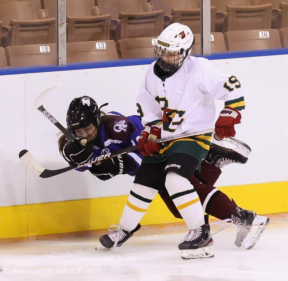 Oyster River/Portsmouth's Maggie Farwell, left, seen here during last Saturday's championship game against Bishop Guertin, was named a Division I all-state first-team defenseman.