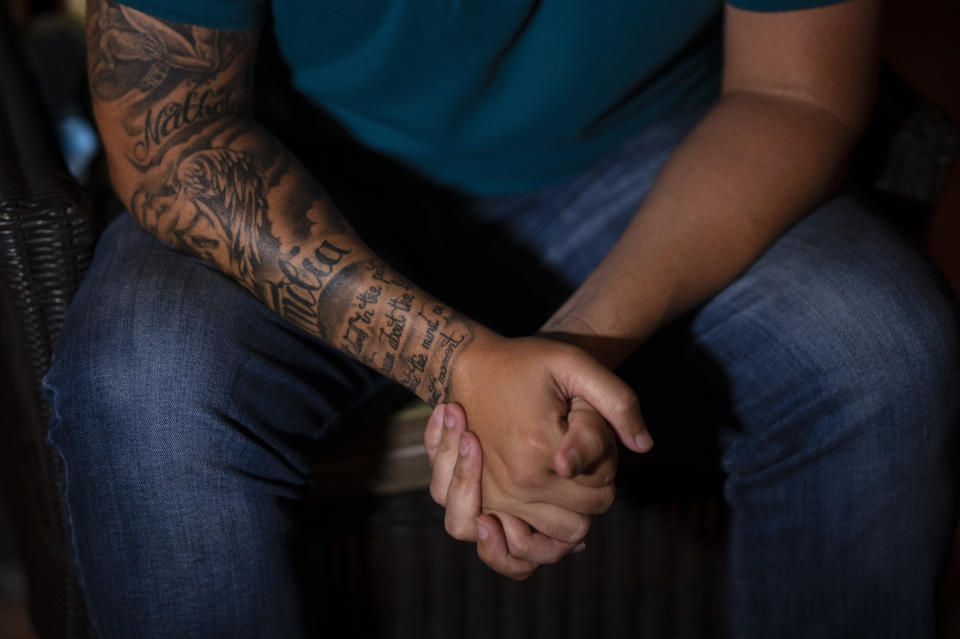 Jose Irizarry, a once-standout DEA agent sentenced to more than 12 years in federal prison for conspiring to launder money with a Colombian cartel, sits during an interview the night before going to a federal detention center, in San Juan, Puerto Rico, Wednesday, Jan. 5, 2022. (AP Photo/Carlos Giusti)