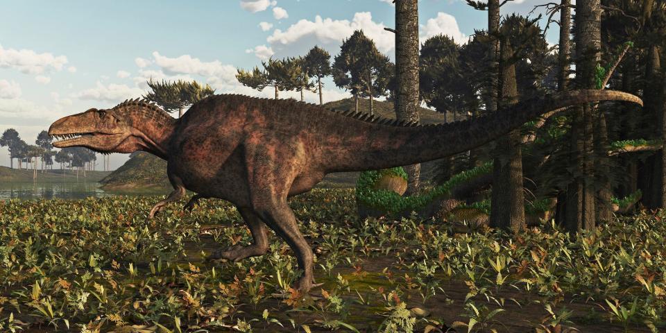 An artist's impression of an Acrocanthosaurus, a bipedal dinosaur in a lush green landscape.