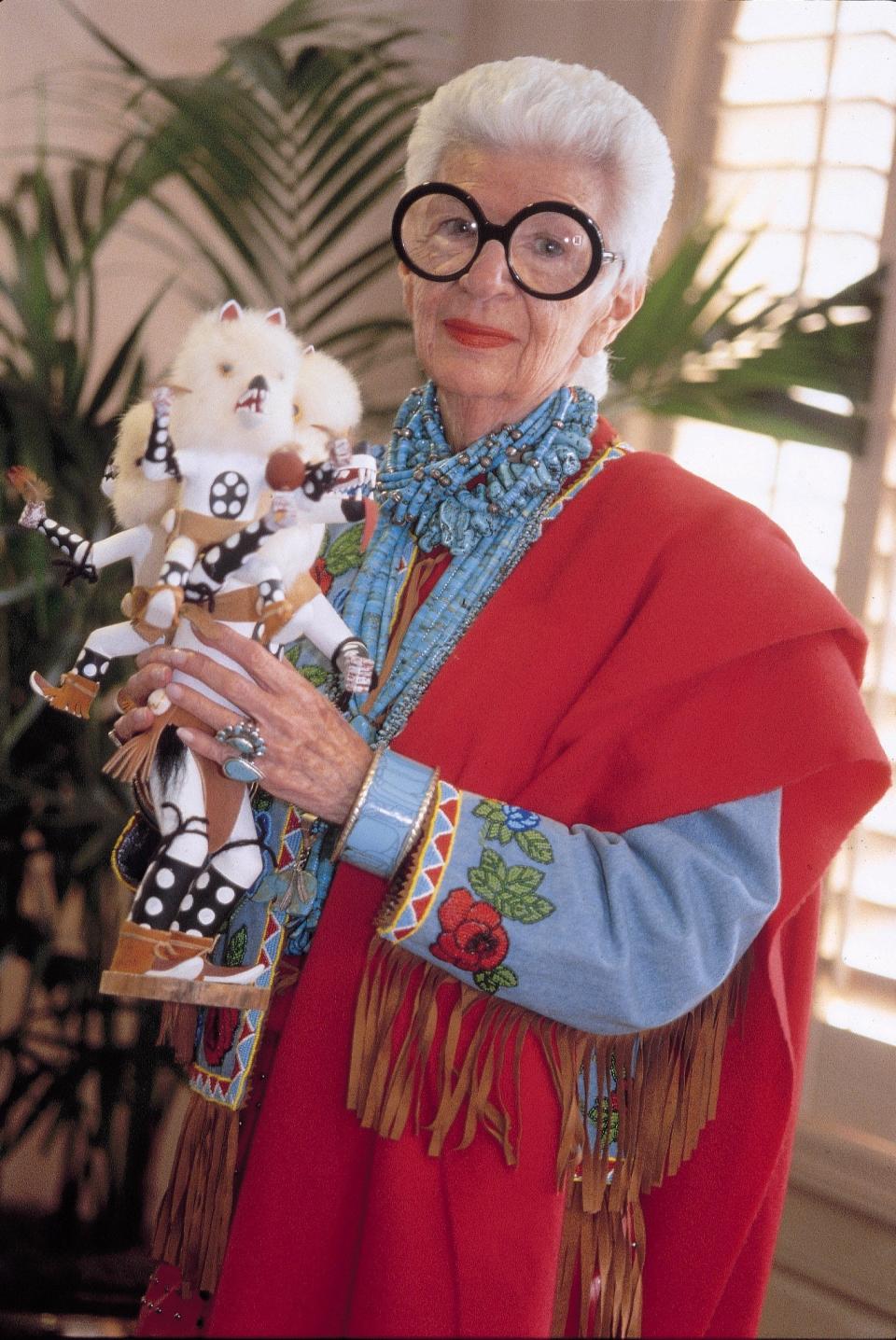 Iris Apfel displays a "bogey man" kachina figure in this file photo.