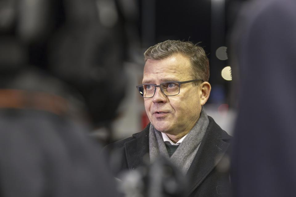 Finland's Prime Minister Petteri Orpo speaks at a press briefing during a visit to the Vartius border crossing station in Kuhmo, eastern Finland, Monday Nov. 20, 2023. The prime minister on Monday said the country may need to take further actions on its border with Russia after closing four border crossings in an attempt to stem a recent increase in asylum-seekers. (Hannu Huttu/Lehtikuva via AP)