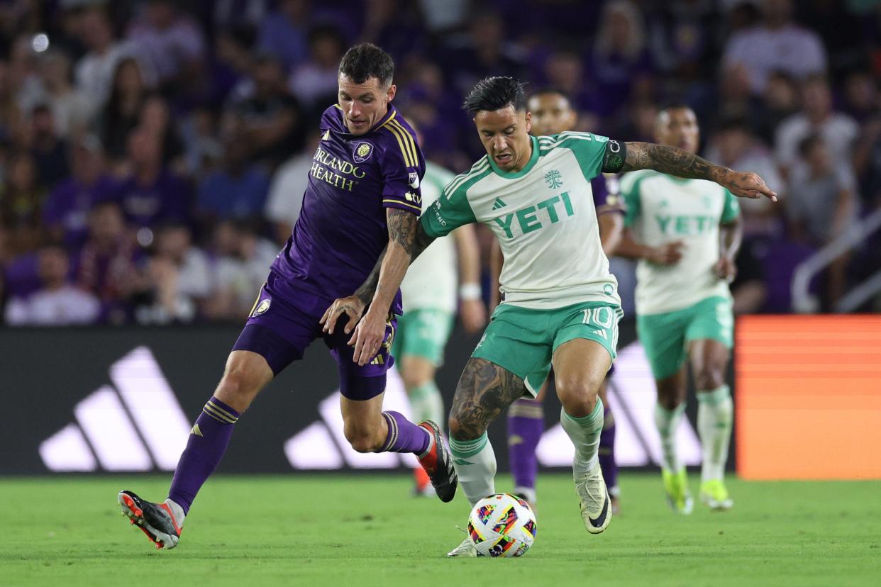 Mar 23, 2024; Orlando, Florida, USA; Orlando City defender Kyle Smith (24) and Austin FC midfielder Sebastian Driussi (10) battle for the ball in the second half at Inter&Co Stadium. Mandatory Credit: Nathan Ray Seebeck-USA TODAY Sports