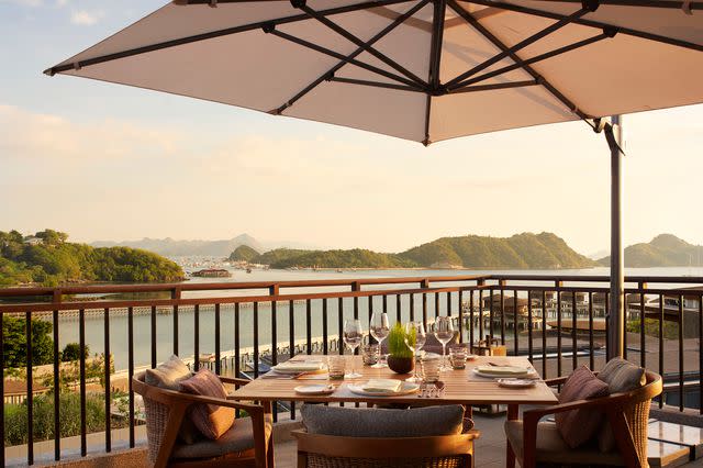 <p>Courtesy of TA’AKTANA, a Luxury Collection Resort & Spa, Labuan Bajo</p> Leros, the resort's all-day restaurant, offers spectacular views.