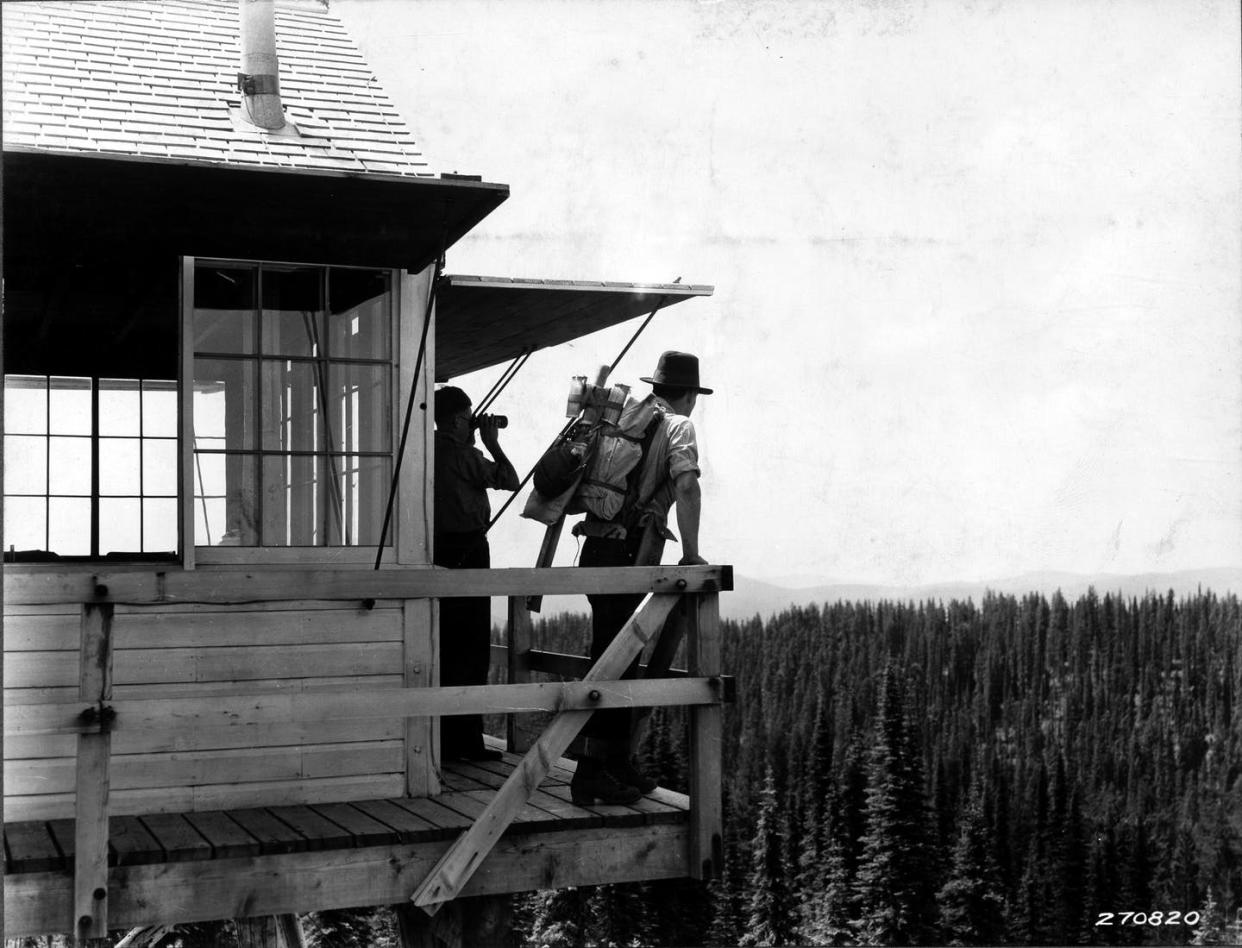 <span class="caption">Before satellites, fire crews watched for smoke from fire towers across the national forests.</span> <span class="attribution"><span class="source">K. D. Swan, U.S. Forest Service</span></span>