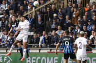 Brugge's Maxim De Cuyper, left, heads the ball as Fiorentina's Nicolas Gonzalez, second left, defends during the Europa Conference League semi-final second leg soccer match between Club Brugge and Fiorentina at the Jan Breydel Stadium in Bruges, Belgium, Wednesday, May 8, 2024. (AP Photo/Omar Havana)