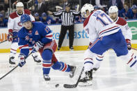 New York Rangers right wing Jesper Fast, left, skates next to Montreal Canadiens defenseman Brett Kulak during the second period of an NHL hockey game, Friday, Dec. 6, 2019, at Madison Square Garden in New York. (AP Photo/Mary Altaffer)