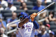 New York Mets' Starling Marte hits a home run during the first inning of a baseball game against the Texas Rangers on Sunday, July 3, 2022, in New York. (AP Photo/Adam Hunger)