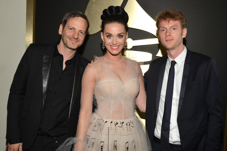 Producer Dr. Luke, singer Katy Perry and producer Cirkut attend the 2014 Grammy Awards ceremony.