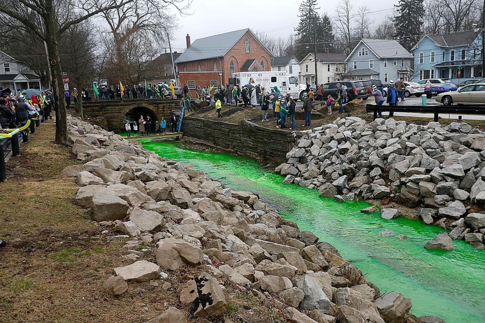 The city of Ashland turns Center Run Creek green for St. Patrick's Day Friday, March 17, 2023. TOM E. PUSKAR/ASHLAND TIMES-GAZETTE