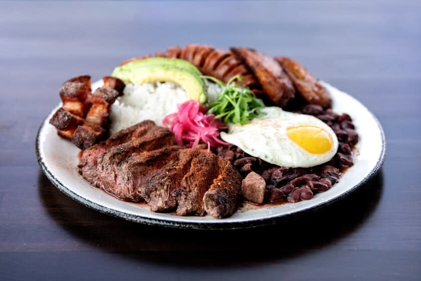 LONG BEACH, CA - JUNE 10: Bandeja paisa from Selva on Friday, June 10, 2022 in Long Beach, CA. Part of the brunch menu, the Bandeja paisa comes with flat iron, rice and beans, chicharron, sweet plantains, and chorizo.(Mariah Tauger / Los Angeles Times)