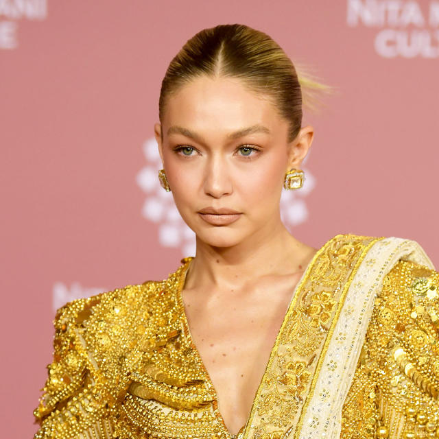 Gigi Hadid Stuns In A Gold Ensemble At The NMACC Gala In Mumbai