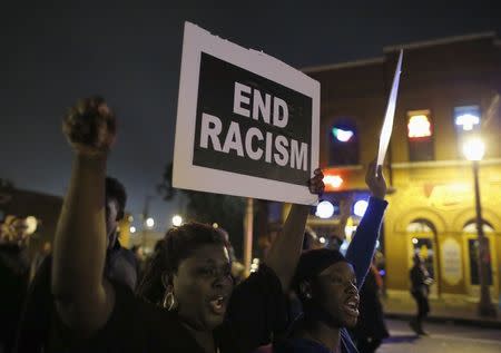 Protesters demonstrate during a march through the streets late into the night, in St Louis, Missouri late October 12, 2014. REUTERS/Jim Young