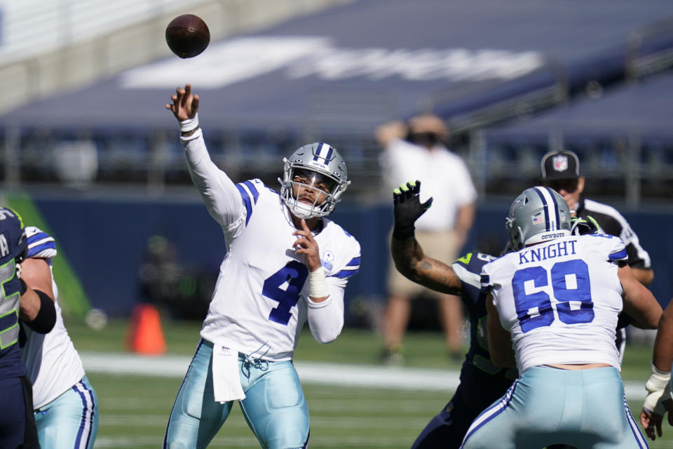 Dallas Cowboys quarterback Dak Prescott passes against the Seattle Seahawks during the first half of an NFL football game, Sunday, Sept. 27, 2020, in Seattle. (AP Photo/Elaine Thompson)
