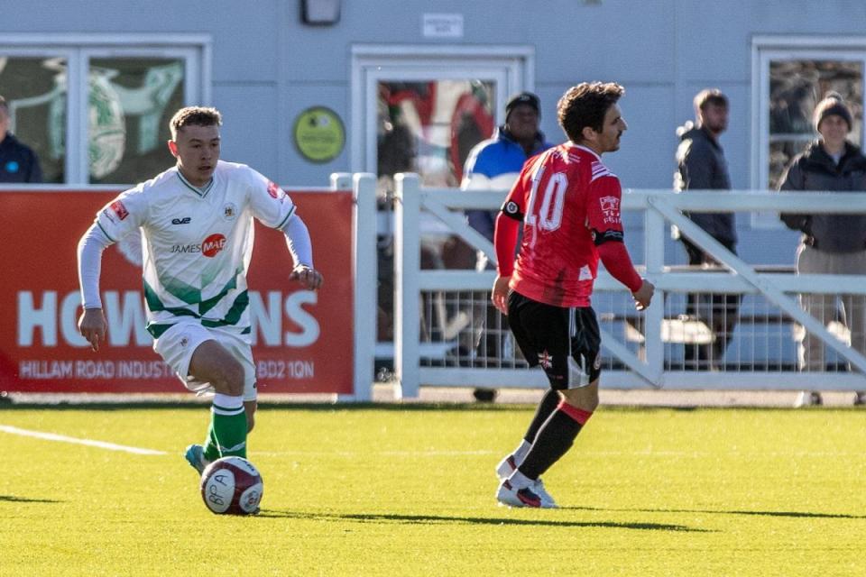 Lucas Odunston (left) in action for Bradford (Park Avenue) against Hyde at Horsfall last season. <i>(Image: John Rhodes.)</i>