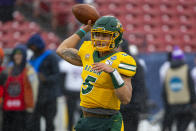 North Dakota State quarterback Trey Lance (5) warms up before the FCS championship NCAA college football game against James Madison, Saturday, Jan. 11, 2020, in Frisco, Texas. (AP Photo/Sam Hodde)