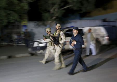 Afghan security forces arrive at the site of an attack in Kabul May 13, 2015. REUTERS/Mohammad Ismail