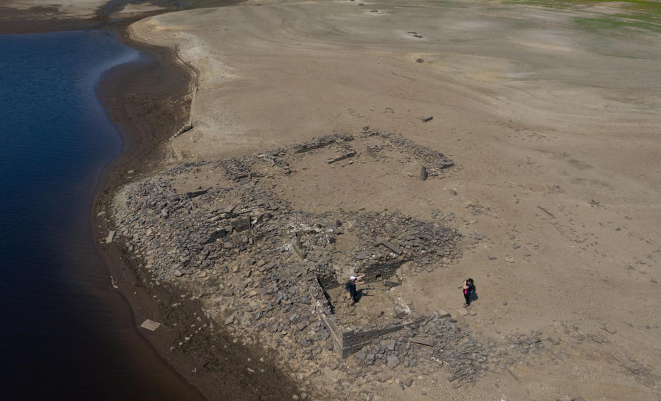 Ladybower reservoir in the Peak District does so low remains of the Ashopton can be seen. August 14 2022.